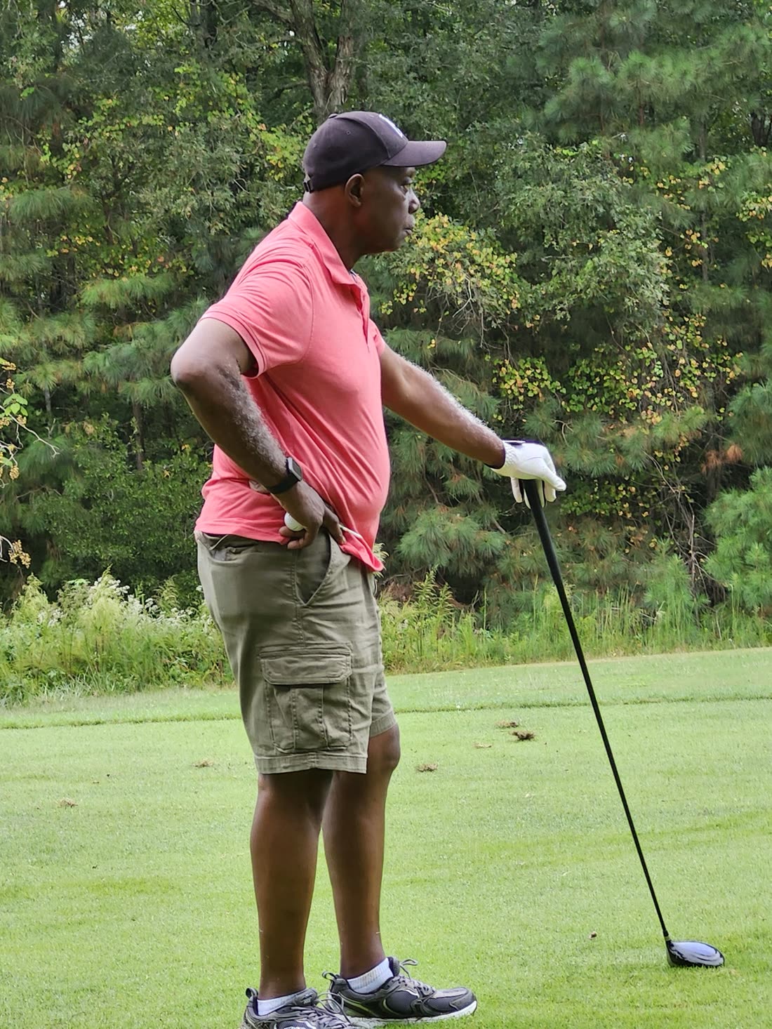 Bernard standing on a golf course.