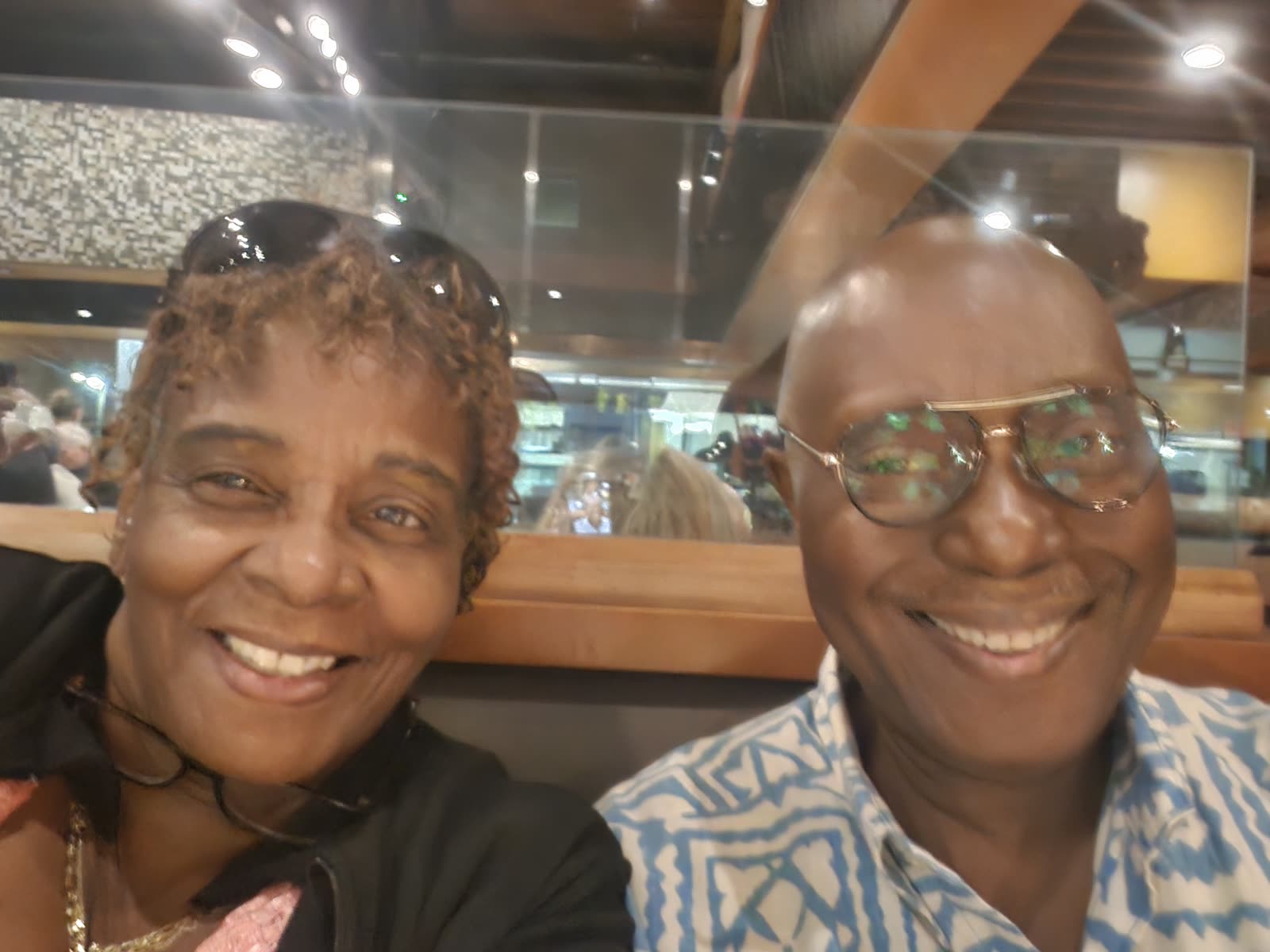 Bernard smiling with family.